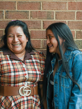 Legal Aid client laughing with her daughter